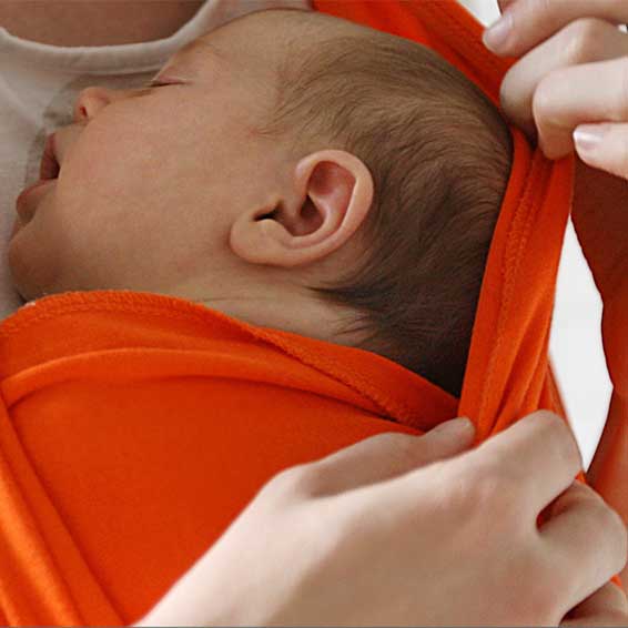 Mother holding sleeping baby