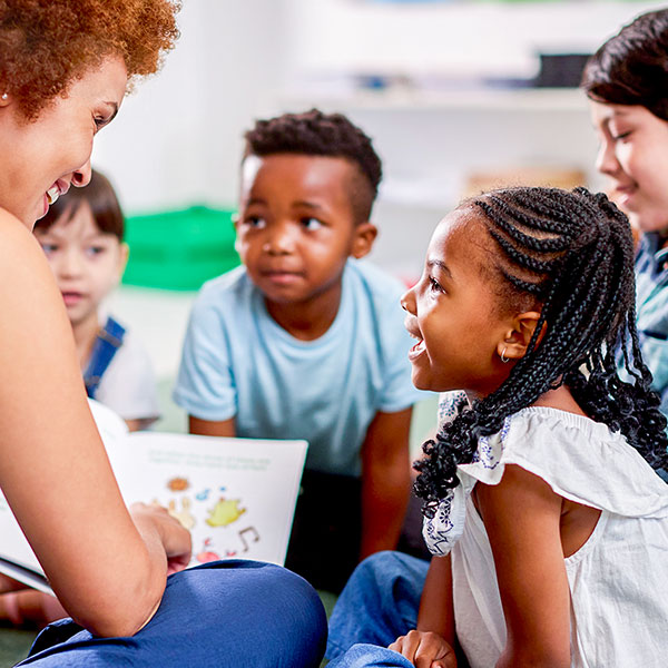Teacher reading to small group of students
