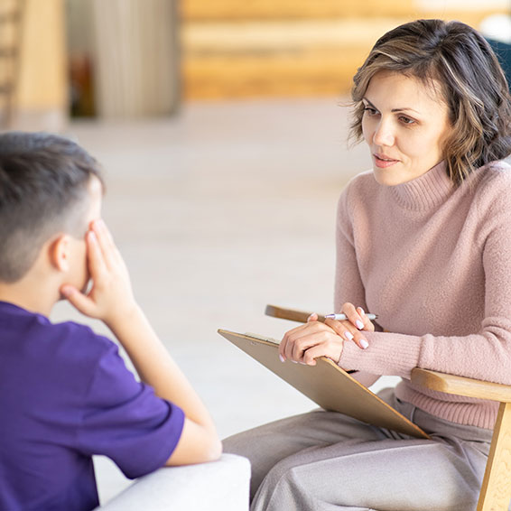 Adult speaking with student