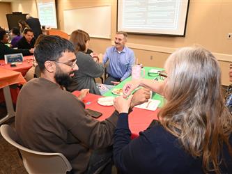 Employees engaging in a Hmong New Year connection activity