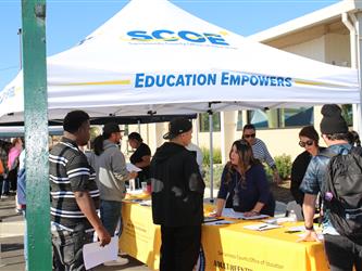 Employees meeting participants at a Reentry resource fair