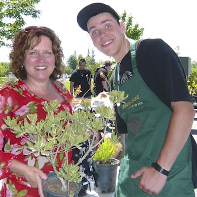 Employee buying plants from student