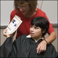 Student holding certificate