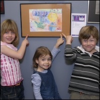Students pointing at artwork