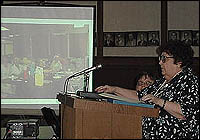 Jan Talbot in front of projection screen