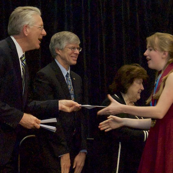 Student receiving scholarship check