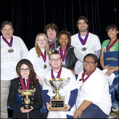 Leo A. Palmiter Academic Bowl team holding trophies
