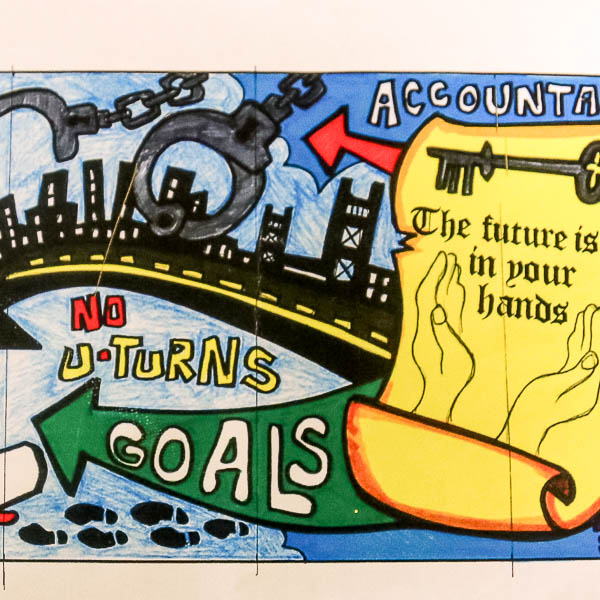 A paper mockup showing sections of the planned mural