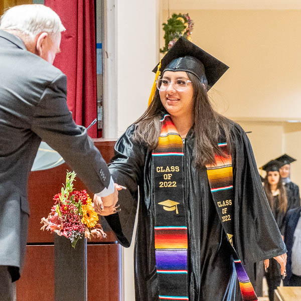 Graduate shaking hands