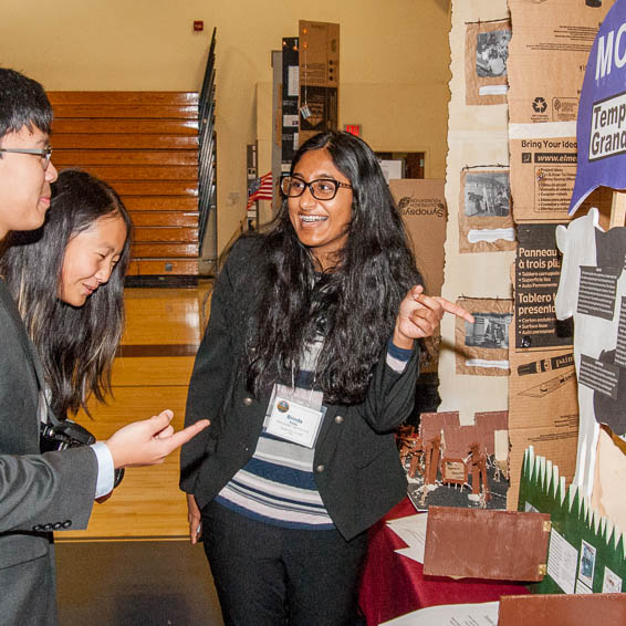 Student explaining project to other students