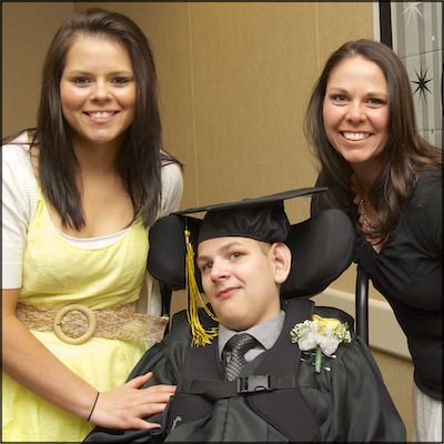 Student posing with family