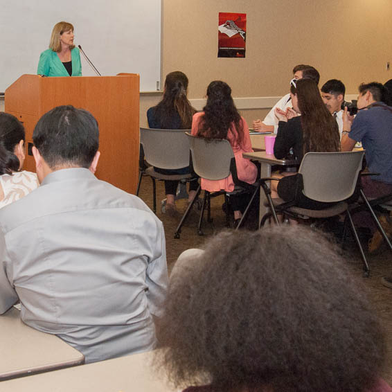 Joyce Terhaar talking to seated students