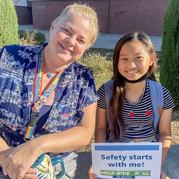 Student holding sign: safety starts with me