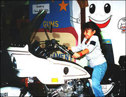 Girl sitting on a police motorcycle