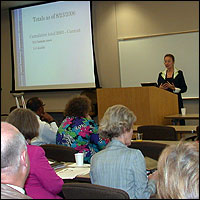 Speaker addressing meeting attendees