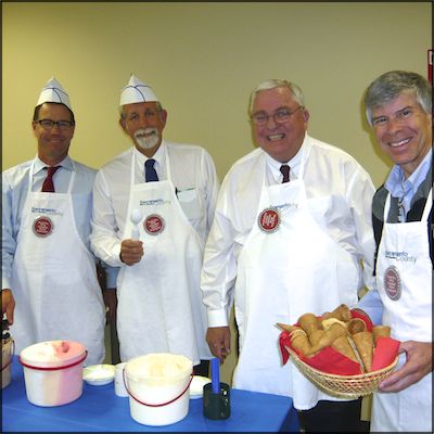 Superintendent and Cabinet serving ice cream