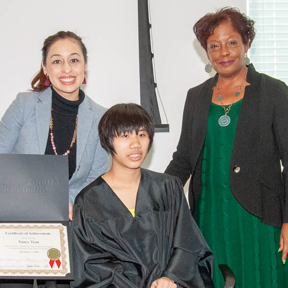 Karina Talamantes and Carmen Walker with a student