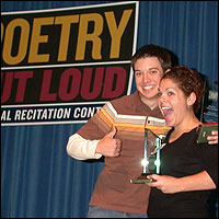 Students on stage with awards