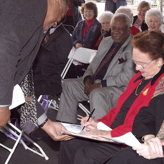 Elinor Hickey signs Ralph DeLoach's yearbook