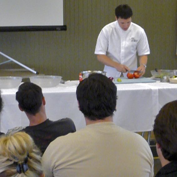 Chef Tyler Stone slicing tomatoes