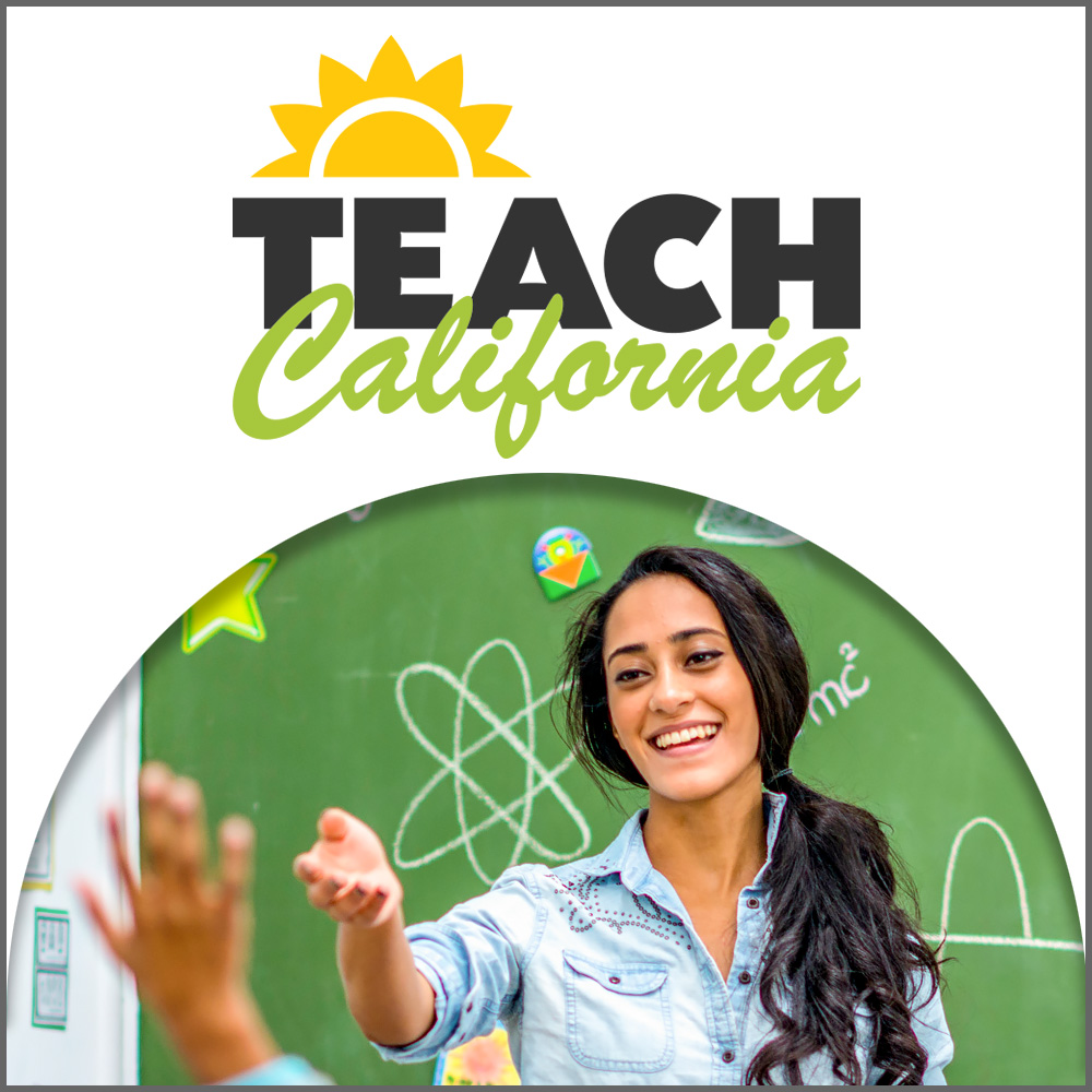 Female teacher standing in front of a chalkboard