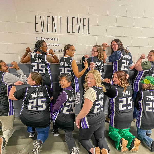 Teachers posing with jerseys