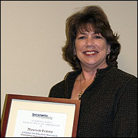 Maureen Gemma holding plaque