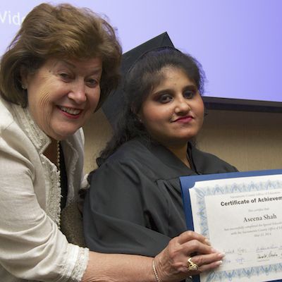 Eleanor L. Brown presenting certificate to graduate