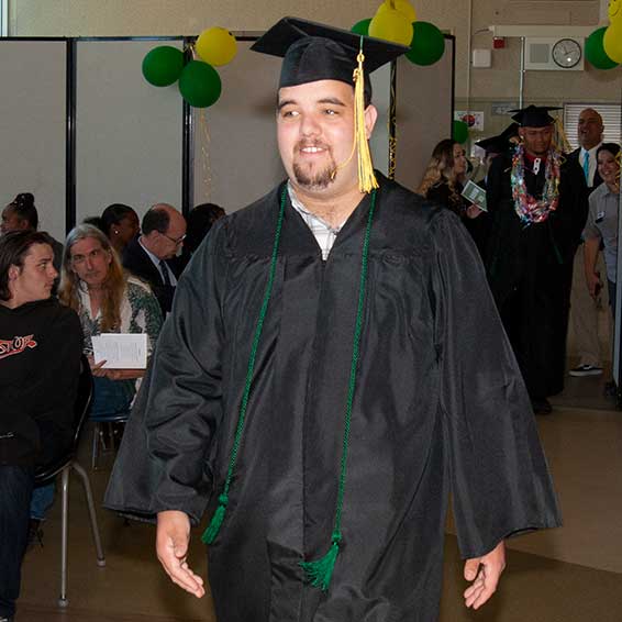 Graduate wearing cap and gown