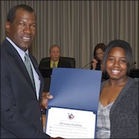 Student speaker receiving certificate