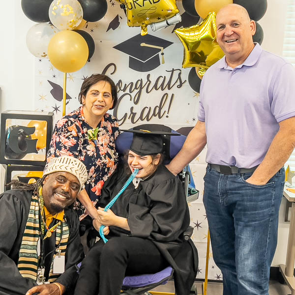 Family posing with student