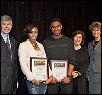 Contest winners holding plaques pose with Board members