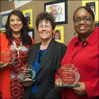 Michelle Ramirez, Paula Duncan, and Janis Wade holding plaques