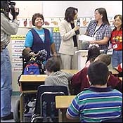 Reporter interviewing staff