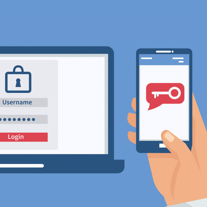 Hand holding a phone authenticates login credentials to access computer