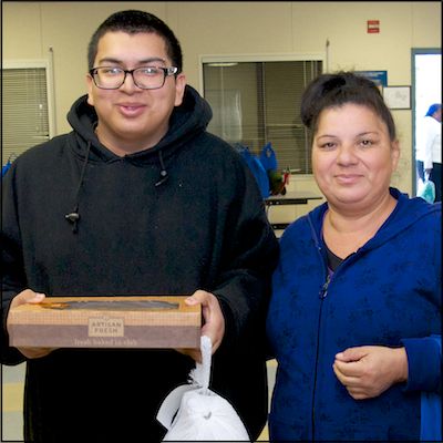 Student holding pie