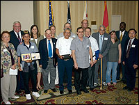 Diploma recipients pose with Board members