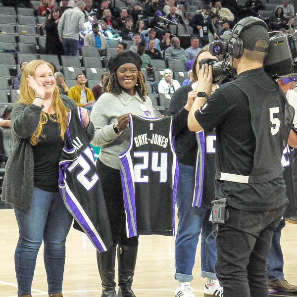 Teachers waving on the court as their names are called
