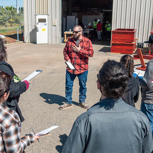 NCCT instructor speaking to visitors