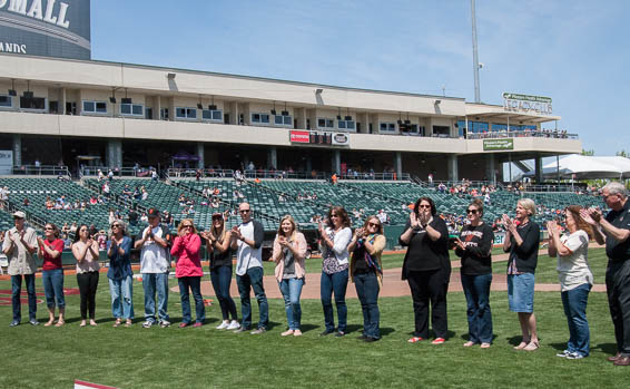 Teachers lined up on baseball field