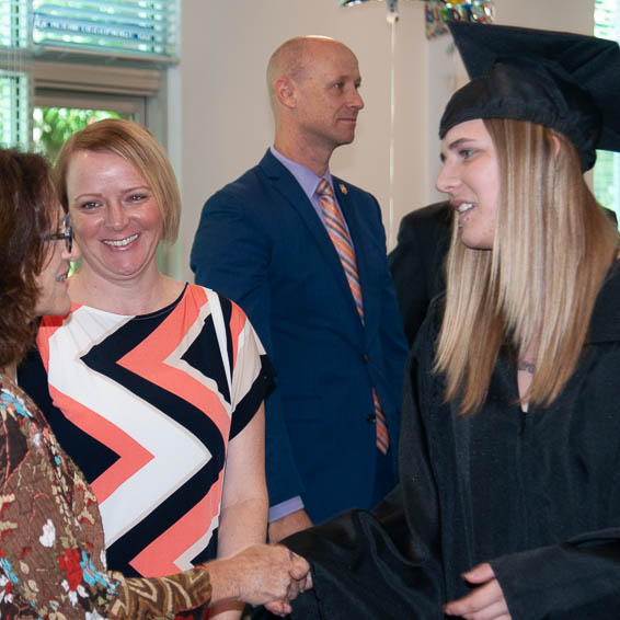 Graduate shaking hands