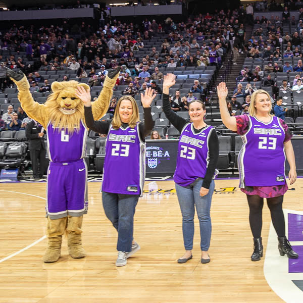 Teachers waving to the crowd