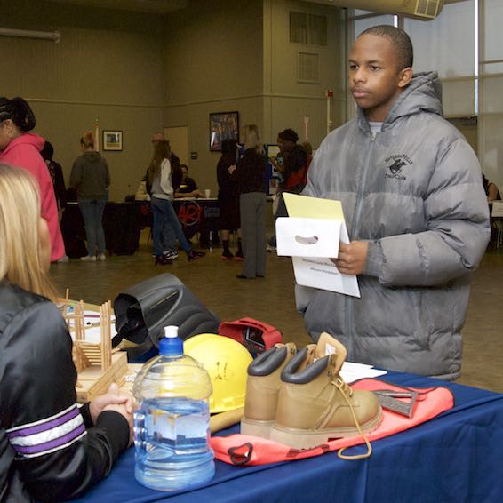 Student receiving information at table