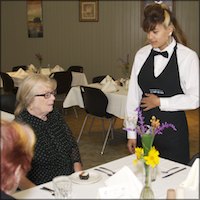 Student waitress taking food orders