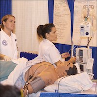 Student works with medical mannequin