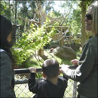 Student with parent and teacher at zoo