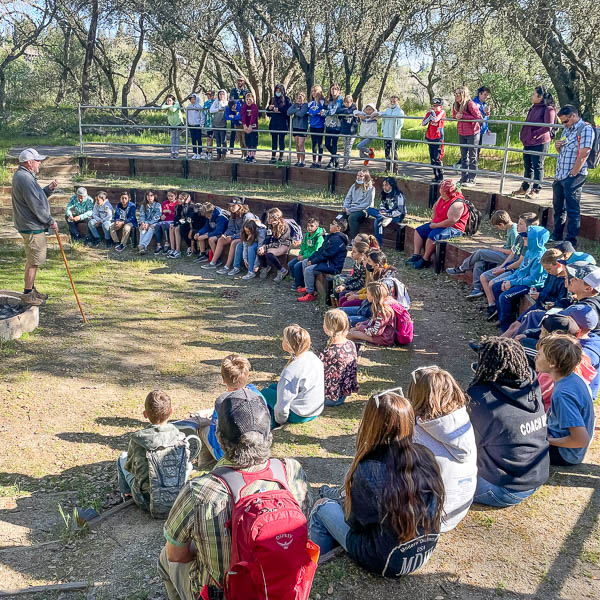 Students in amphitheater listening to instructor