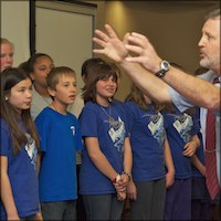 Director with students singing