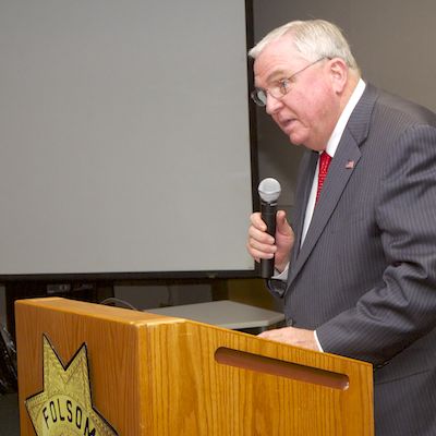 David W. Gordon speaking at podium