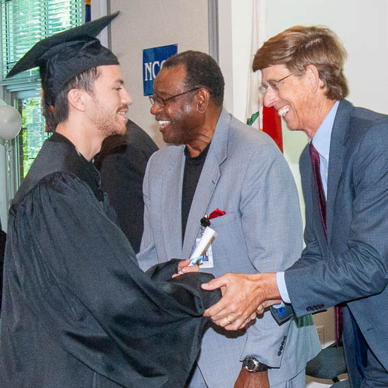 Certificate recipient shaking hands